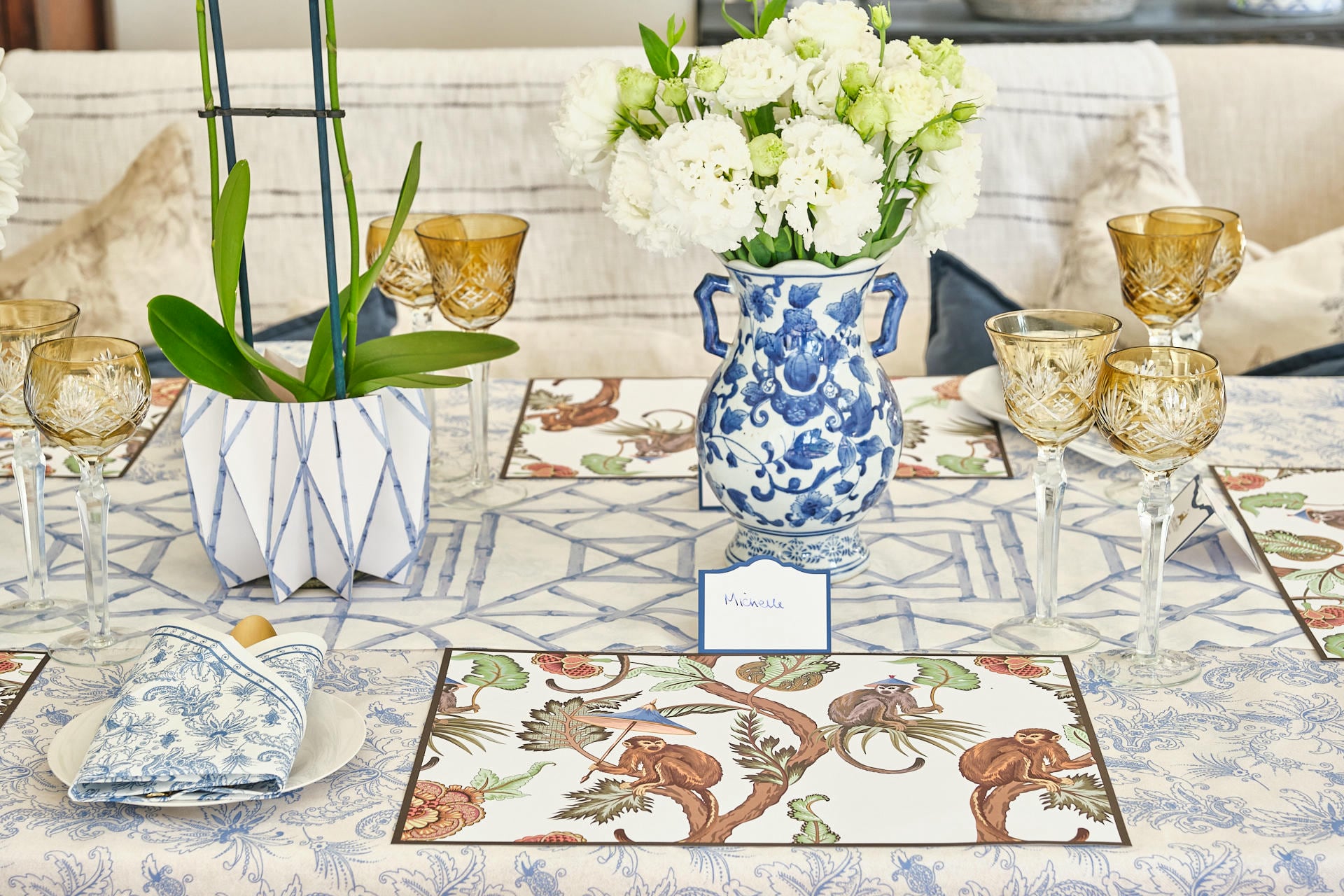 Luxury tablescape with Paisley tablecloth and serviettes in Sky, Mocha Monkeys placemats, Bamboo vase wraps and Designer Bamboo Trellis runner by Simple Soirées